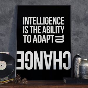 Intelligence is the ability to adapt to change - plakat w ramie, wymiary - 60cm x 90cm, wersja - czarne napisy + białe tło, kolor ramki - biały